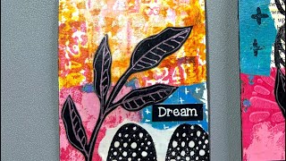 Mixed media art card using collage, distress spray stain, stamps and more.