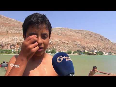 عين الطاقة بحيرة طبيعية يقصدها الأهالي في ريفي إدلب وحماة للإستجمام