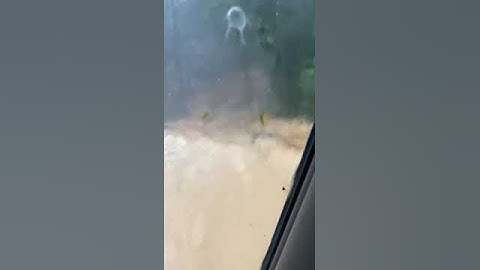 TYPICAL SURFACE RUNOFF UNDER HEAVY RAIN IN SABAH= CROSSING THE ROAD 14 FEB 2023