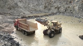 Big & Powerful Caterpillar 966D is Performing the Rock Loading Task at Mining Site