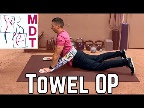 Extension in Lying (Towel Overpressure) — Mechanical Diagnosis and Therapy (McKenzie Method)