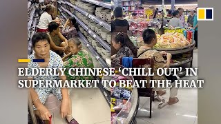 Elderly Chinese ‘chill out’ in air-conditioned supermarket to beat the heat
