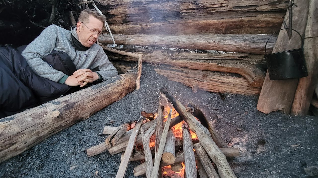 ⁣Bushcraft Shelter Camping Under Northern Lights (Best Campfire Meal Ever!)