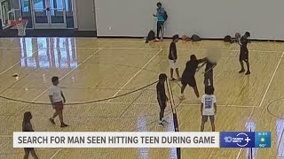 Police searching for man caught on video punching teen during basketball game