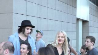 Nick Simmons sings NWA as he talks about movie Sraight Outta Compton outside Lucky Strike