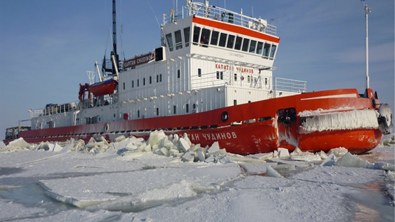 Tug boat breaking ice in northern Sweden