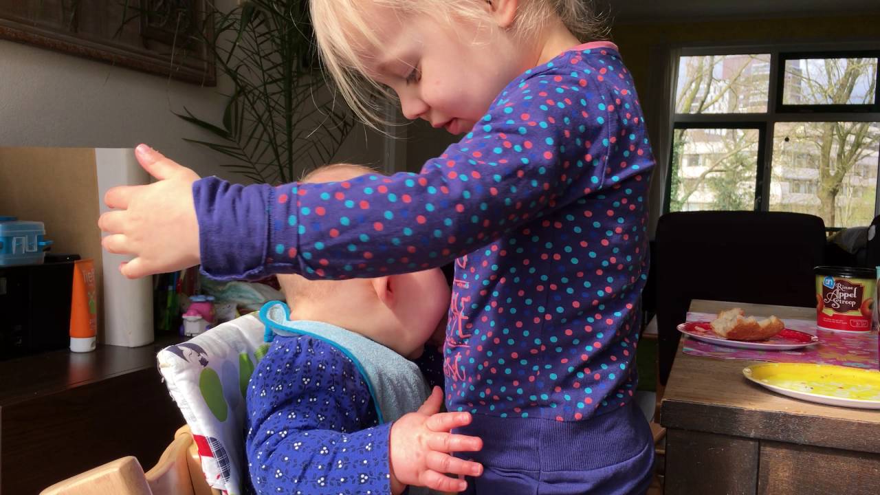 This Baby Cuddling With Her Sister Will Melt Your Heart