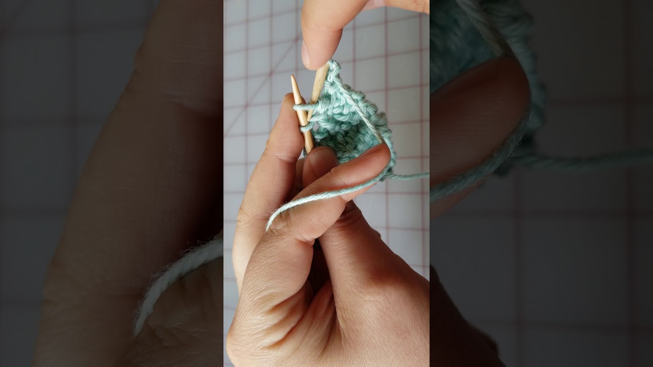 Learning purl decreases on a corner to corner dishcloth.