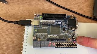 4bit computer on DE10Lite FPGA implementing 2 bit counter stepping by debounced push button VHDL