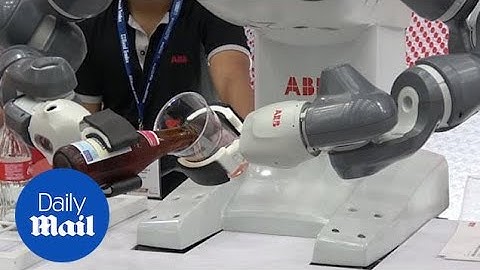 Bottoms up! Robots pour beer at Artificial Intelligence trade show