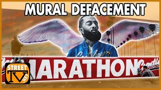 Artists touch-up Nip$ey Hus$le Mural after it was defaced