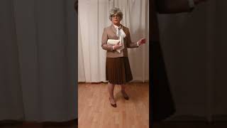 elegant crossdresser - mature lady in pleated leather skirt and silk bow blouse