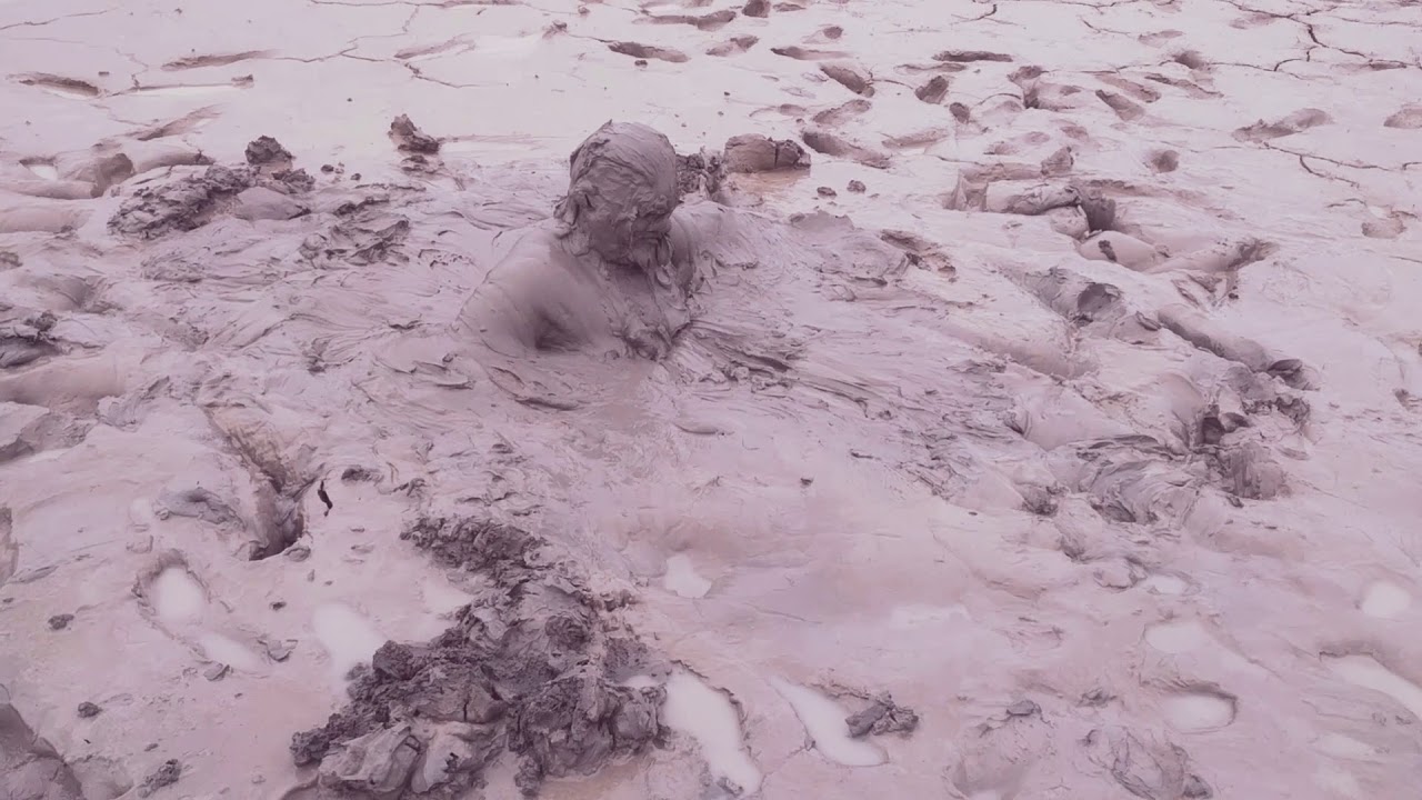 Bathing in sediment mud on a lake site - YouTube