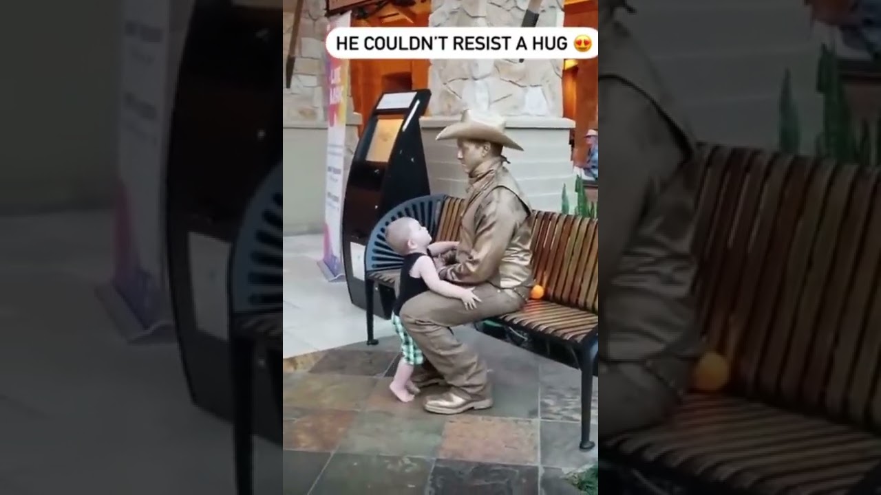 Cute Child hugs statue but finds live human 