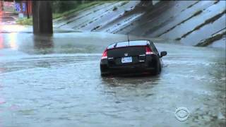 man drives into flooded underpass