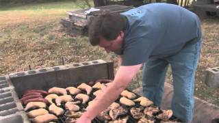Tim shows us the traditional southern way to barbecue that he learned from his grandfather, shoveling hardwood coals into a 