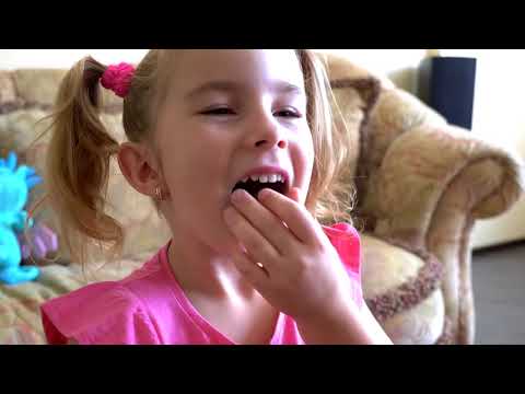 Image of funny baby eating candy food