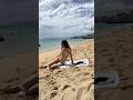 Crossdresser @jezebelform at the beach in a shiny gold bikini