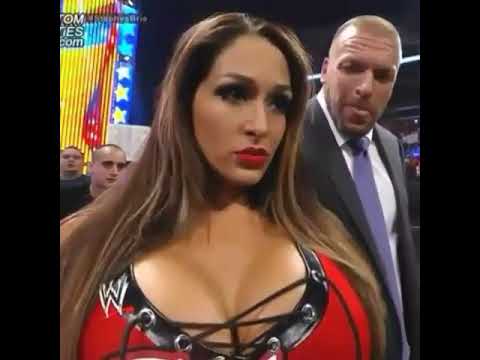 WWE Triple H looks at Nikki Bellas Boobs 