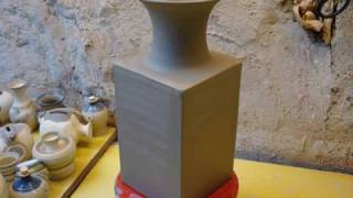 Making / Throwing a square pottery clay vase on the wheel