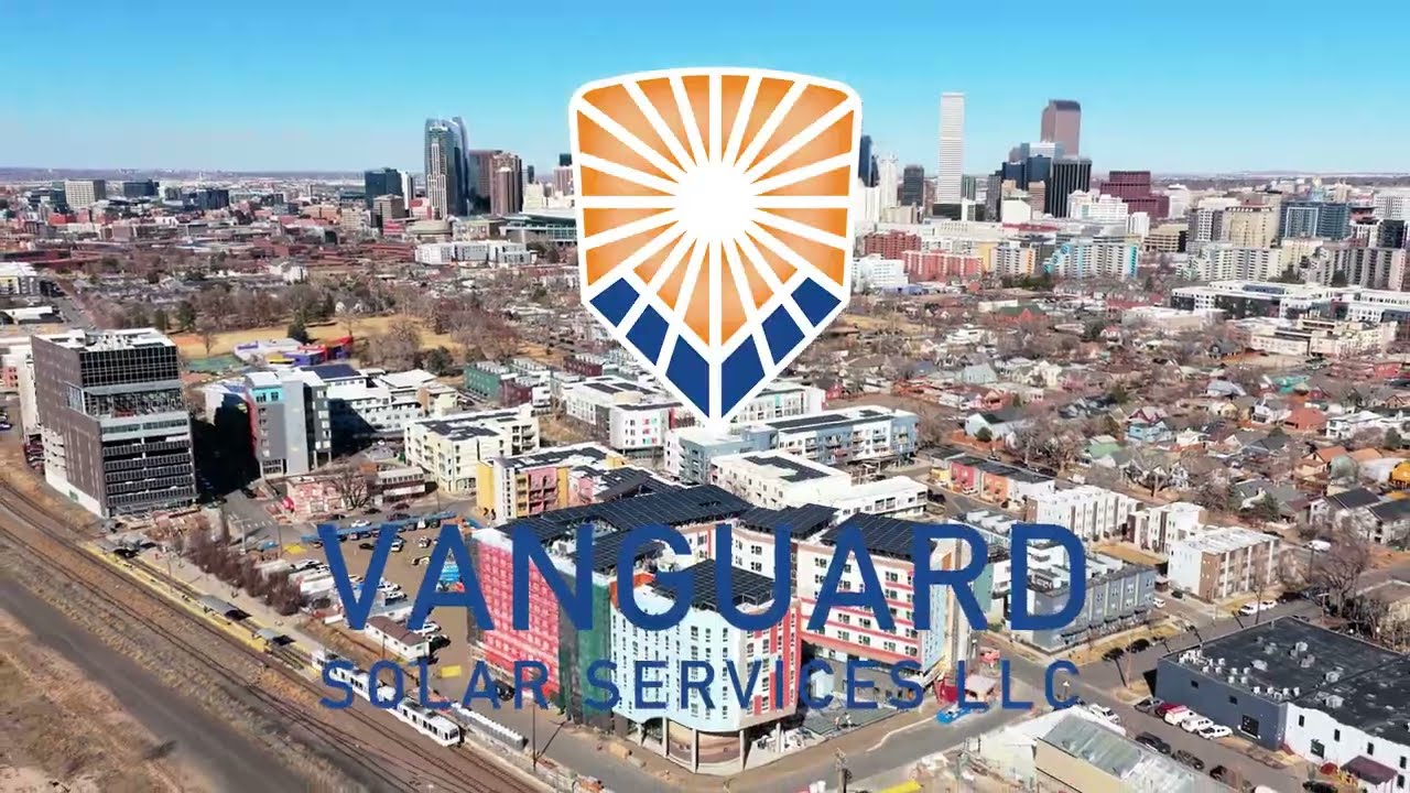 Aerial view of a solar installation and downtown skyline