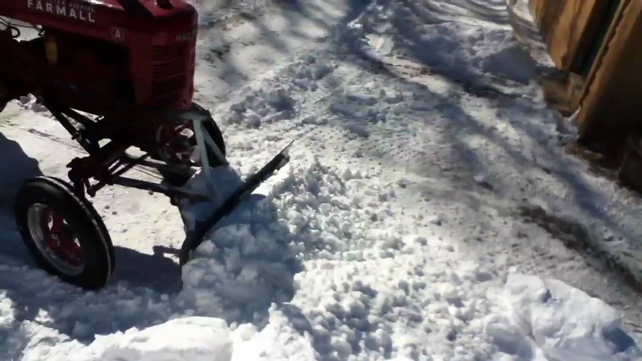 1942 Farmall plowing snow after the 2011 blizzard - YouTube