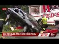 Crews remove car from swimming pool after crashing Monday