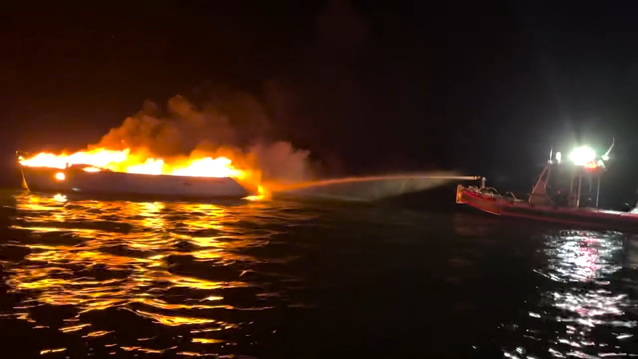 U.S. Coast Guard, Key West Fire department fight boat fire off Sunset Key, Florida