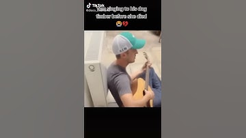 Thumbnail of Tom Felton singing to his dog before she died
