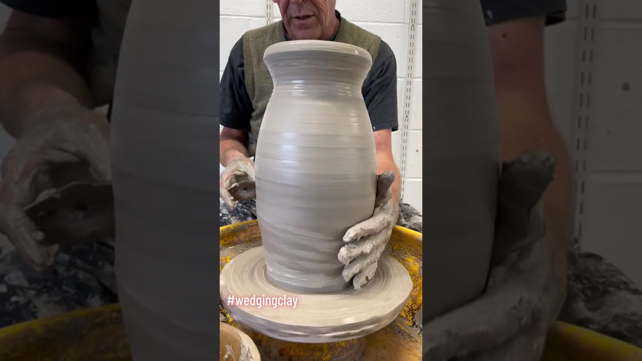Gabriel wedging clay by laminating it #pottery #pots #pottertok #p