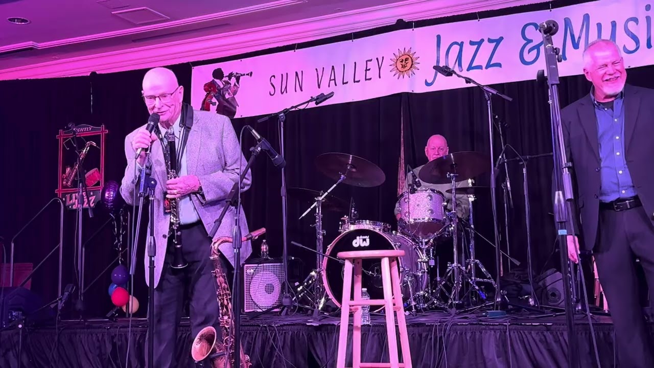 Trombone player performing on stage with a jazz band