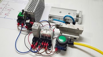 การต่อวงจรค้างสถานะกาาทำงานของกระบอกลม โดยกดปุ่มสตาร์ท และหยุดการทำงานของกระบอกลมด้วยทามเมอร์นับเวลา