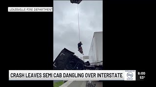 Driver rescued after crash leaves semi-truck cab dangling over overpass near Kennedy Bridge