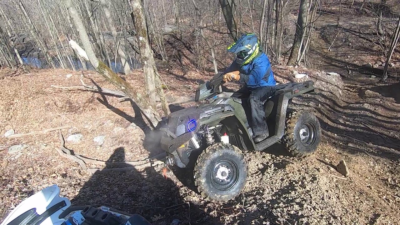 Polaris Sportsmans and Yamaha Grizzlys riding Lost Trails ATV park in