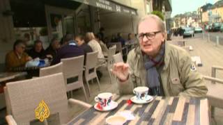 Hollande banks on small-town charm to win