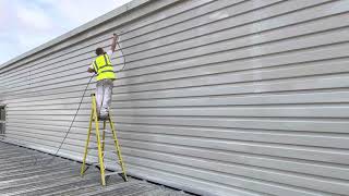 Spray painting industrial cladding
