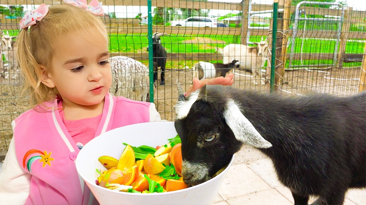 Алиса и её тётя кормят животных на ферме