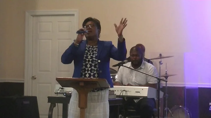 Min L. Cynthia Burnett sings, "I'm Still Holding O...