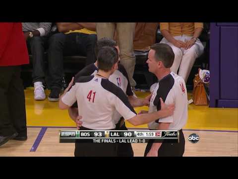 Lakers Celtics 2010 NBA Basketball Finals. Referees Ken Mauer , Mike Callahan , Monty Mccutchen confer to review the out of bounds call and decide to screw t...