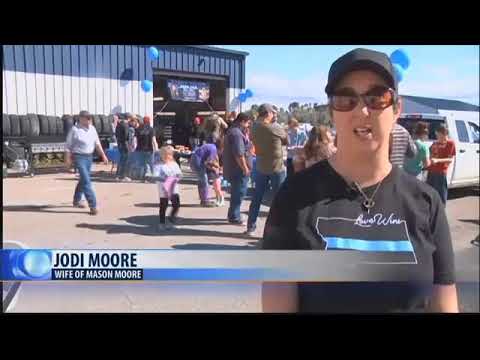 Jodi Moore holds car wash in honor of fallen husband and law enforcement