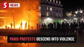 Cars on fire, shattered glass: protests turn violent in Paris