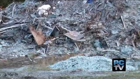 Cleaning up illegal glass dump