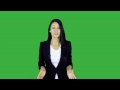 Young lady talking in front of a green screen