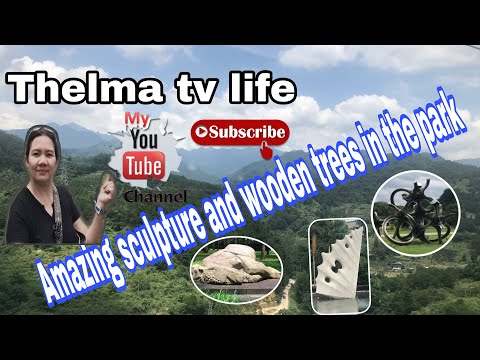 AMAZING SCULPTURE AND WOODEN TREES IN THE PARK