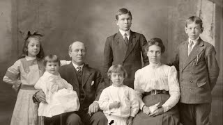 An animated family photograph from the early 20th century