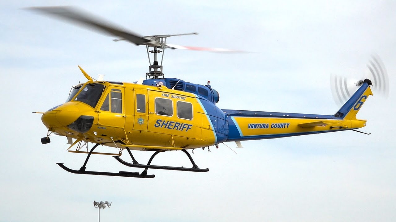 Bell 205 UH-1H Huey helicopter on action | 