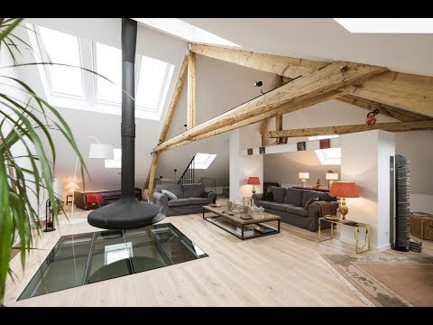 Vidéo: Attic Apartment in Luxembourg combine détails modernes et rustiques