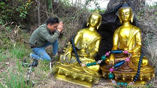 The boy was lucky to find two golden Buddha under the stone while searching for treasure in the wild