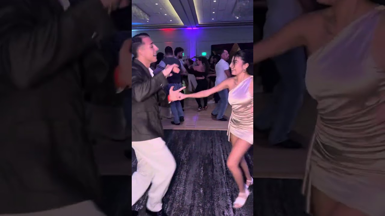 Cristian Vergari and Maria social dancing salsa at San Francisco SBL congress 2025