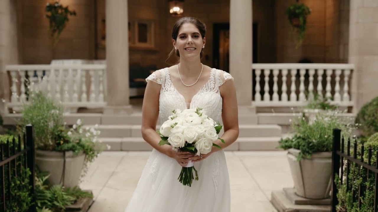 Bride holding a white bouquet in the courtyard at The Wimbish House in Atlanta, GA